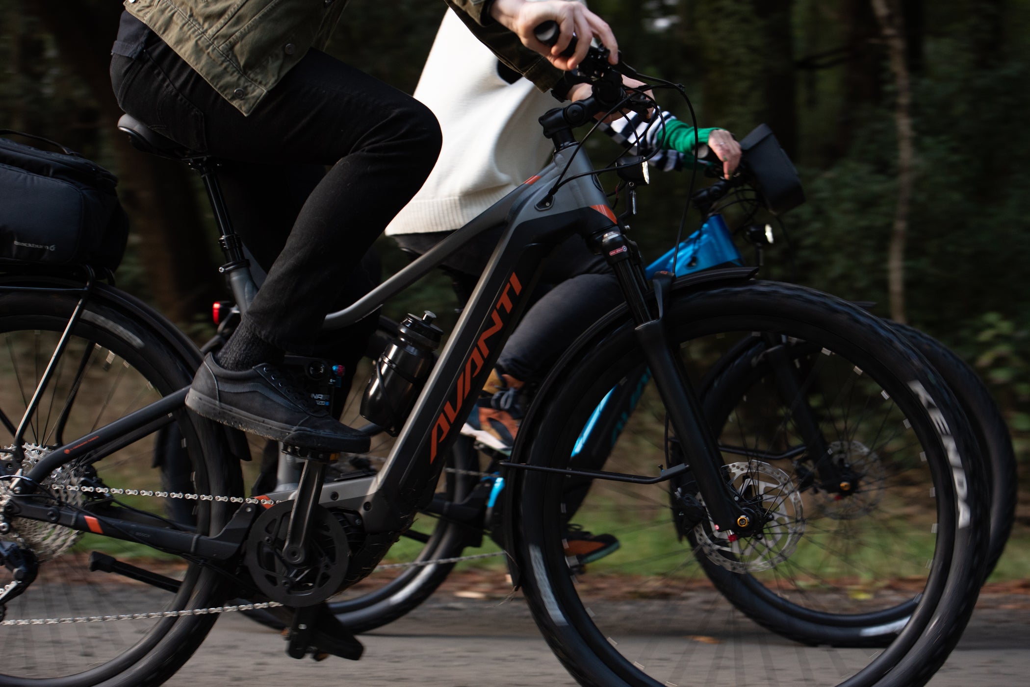 two people pedaling avanti e-bikes